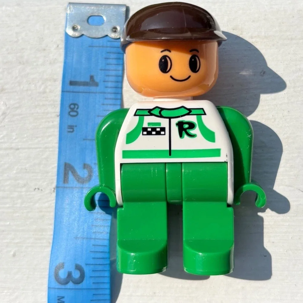 Lego VINTAGE 90s Duplo Racer Minifigure Green White Racing Suit Brown Cap Figure